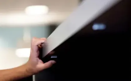 RoomAlyzer Space Desk sensor under a desk in a flexible office, wireless occupancy monitoring